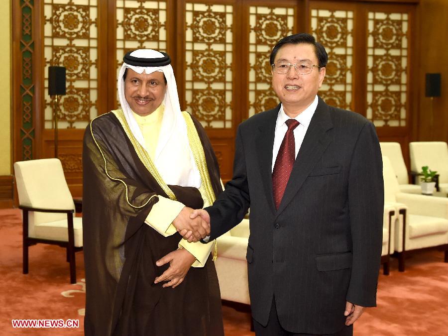 Zhang Dejiang (R), chairman of China's National People's Congress (NPC) Standing Committee, meets with Kuwaiti Prime Minister Sheikh Jaber Al-Mubarak Al-Hamad Al-Sabah in Beijing, capital of China, June 4, 2014