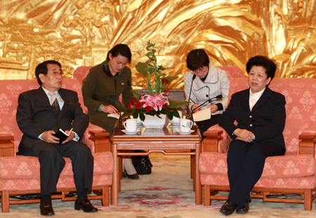 Chen Zhili (1st R), vice chairwoman of the Standing Committee of the National People's Congress, China's top legislature, meets with Jon Yong-jin (1st L), vice chairman of the Committee for Foreign Cultural Relations of the Democratic People's Republic of Korea (DPRK), at the Great Hall of the People in Beijing, capital of China, April 11, 2008. 