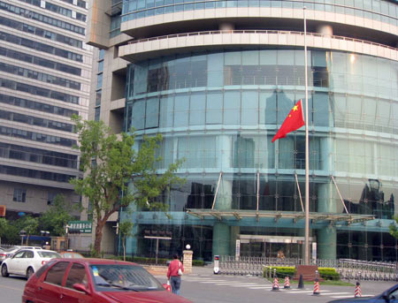 China's national flag flies at half-mast in a Weigongcun residential area in Haidian district, Beijing, capital of China, May 19, 2008. China on Monday begins a three-day national mourning for the tens of thousands of people killed in a powerful earthquake which struck the country's southwestern regions on May 12. 