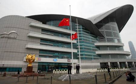 China's national flag flies at half-mast after the flag-raising ceremony at a square in Hong Kong, south China, May 19, 2008. China on Monday begins a three-day national mourning for the tens of thousands of people killed in a powerful earthquake which struck southwest China's Sichuan province on May 12.